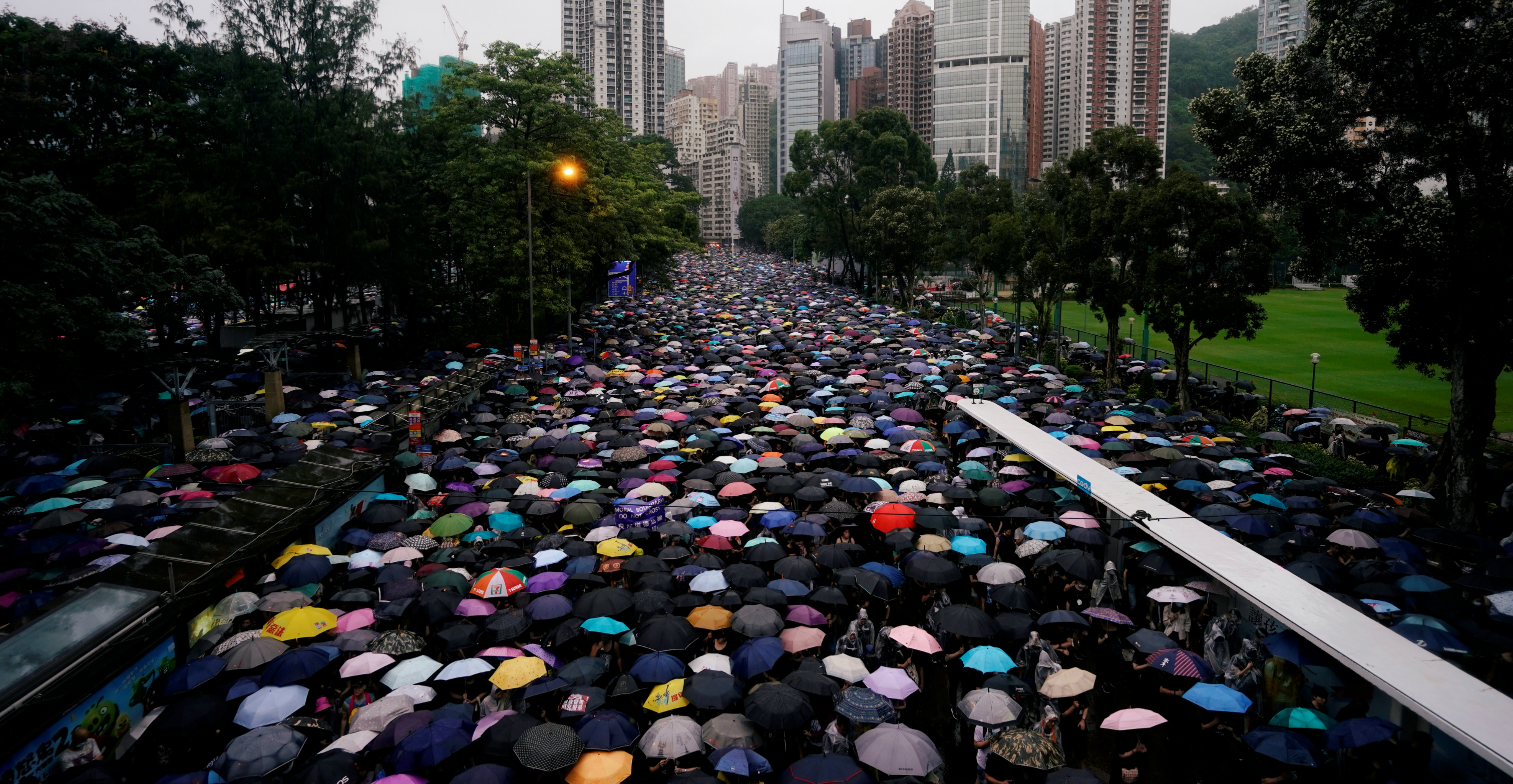 Hundreds of thousands of protesters brave heavy rain to march peacefully from Victoria Park in Causeway Bay to Central on Sunday. Photo: Reuters Hundreds of thousands of protesters brave heavy rain to march peacefully from Victoria Park in Causeway Bay to Central on Sunday. Photo: Reuters