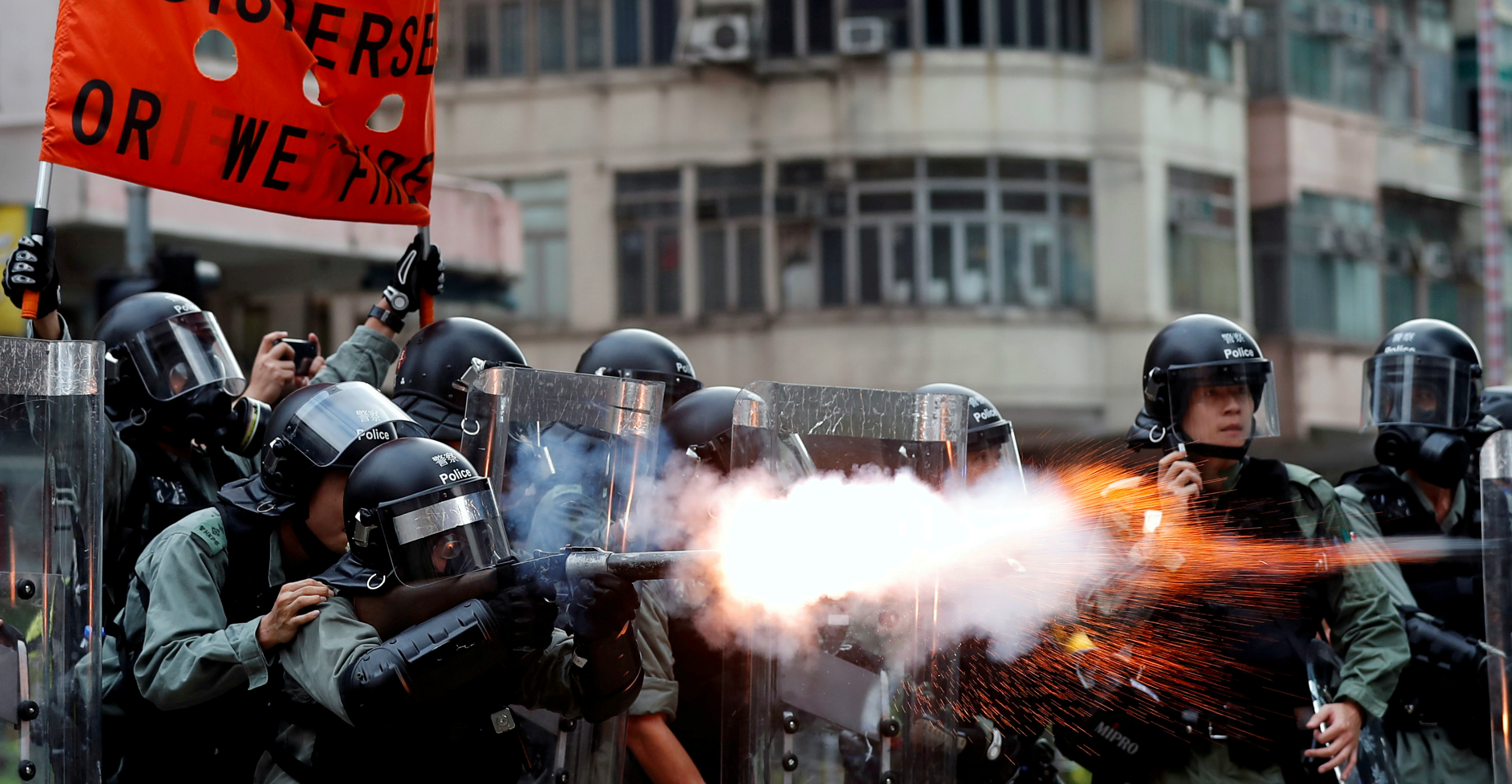 Police officers fire tear gas at protesters in Sham Shui Po on Aug. 11. The sharp rise in applications from Hong Kong for Australia's millionaires-only visa program coincides with the current unrest in the city. Photo: Reuters Police officers fire tear gas at protesters in Sham Shui Po on Aug. 11. The sharp rise in applications from Hong Kong for Australia's millionaires-only visa program coincides with the current unrest in the city. Photo: Reuters