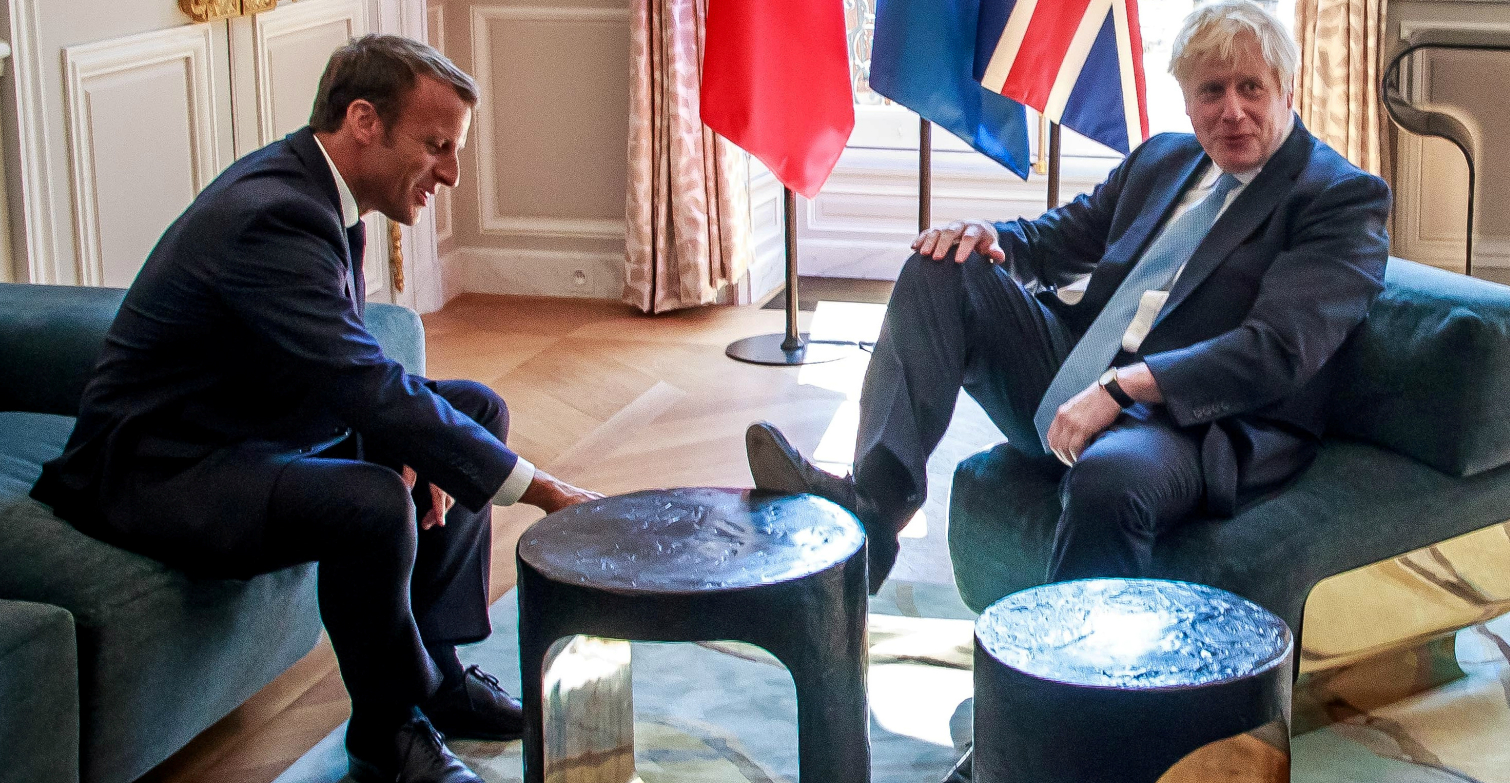 British Prime Minister Boris Johnson briefly rests his foot on a coffee table during his meeting with French President Emmanuel Macron at the Elysee Palace on Thursday. Photo: Reuters British Prime Minister Boris Johnson briefly rests his foot on a coffee table during his meeting with French President Emmanuel Macron at the Elysee Palace on Thursday. Photo: Reuters