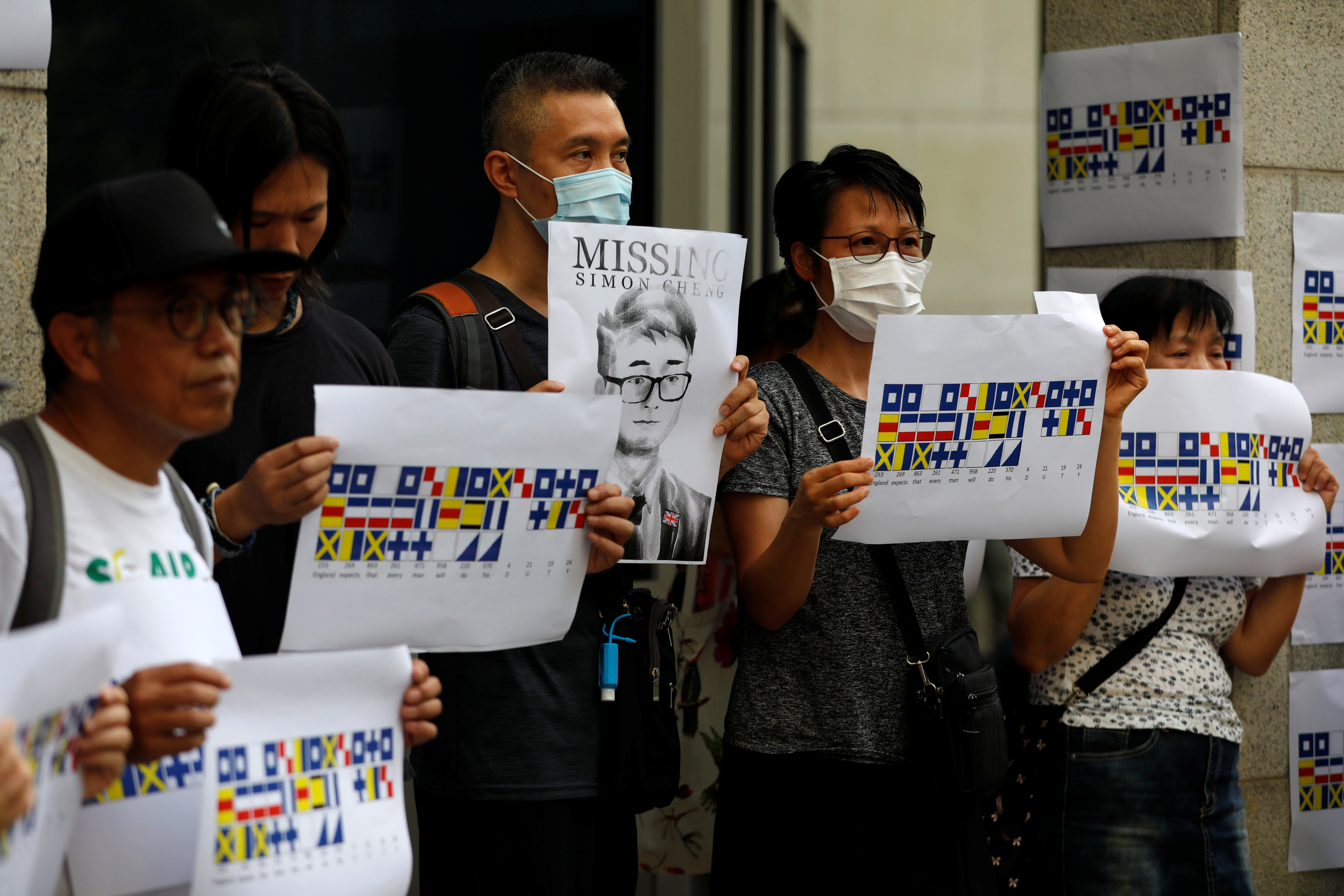 A demonstrator holds a poster of Simon Cheng, a British Consulate staffer who has been detained in Shenzhen. There are doubts as to where exactly Cheng was arrested – at a border crossing or at the China-controlled area of a HK rail station. Pic: Reuters A demonstrator holds a poster of Simon Cheng, a British Consulate staffer who has been detained in Shenzhen. There are doubts as to where exactly Cheng was arrested – at a border crossing or at the China-controlled area of a HK rail station. Pic: Reuters