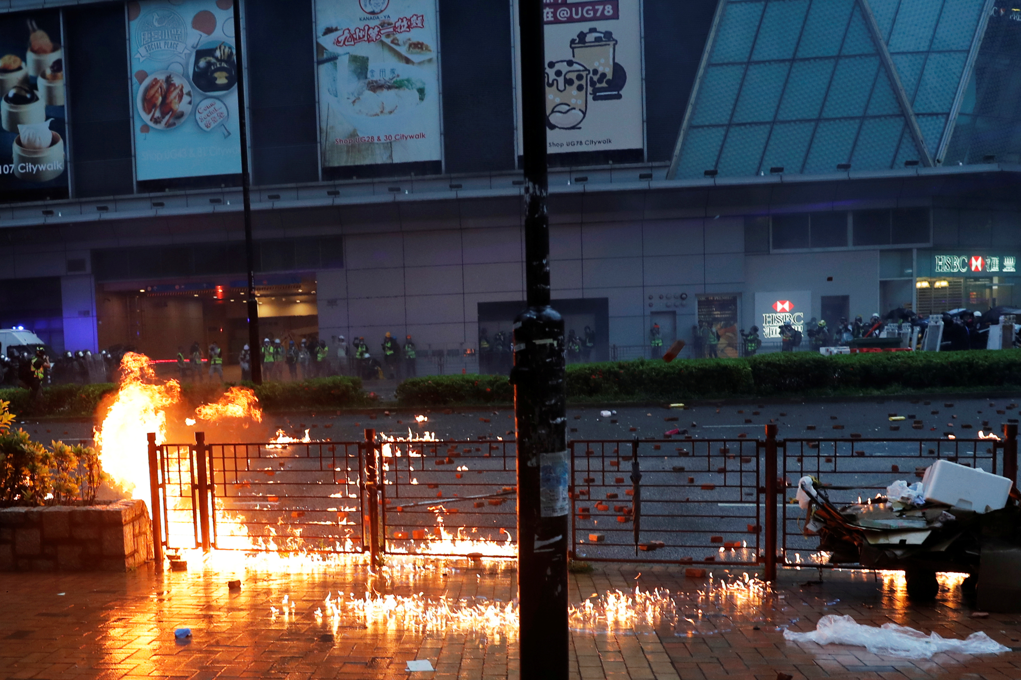 Fire is seen after anti-government protesters throw molotov cocktails during a clash with riot police in Tsuen Wan on Sunday. Photo: Reuters Fire is seen after anti-government protesters throw molotov cocktails during a clash with riot police in Tsuen Wan on Sunday. Photo: Reuters