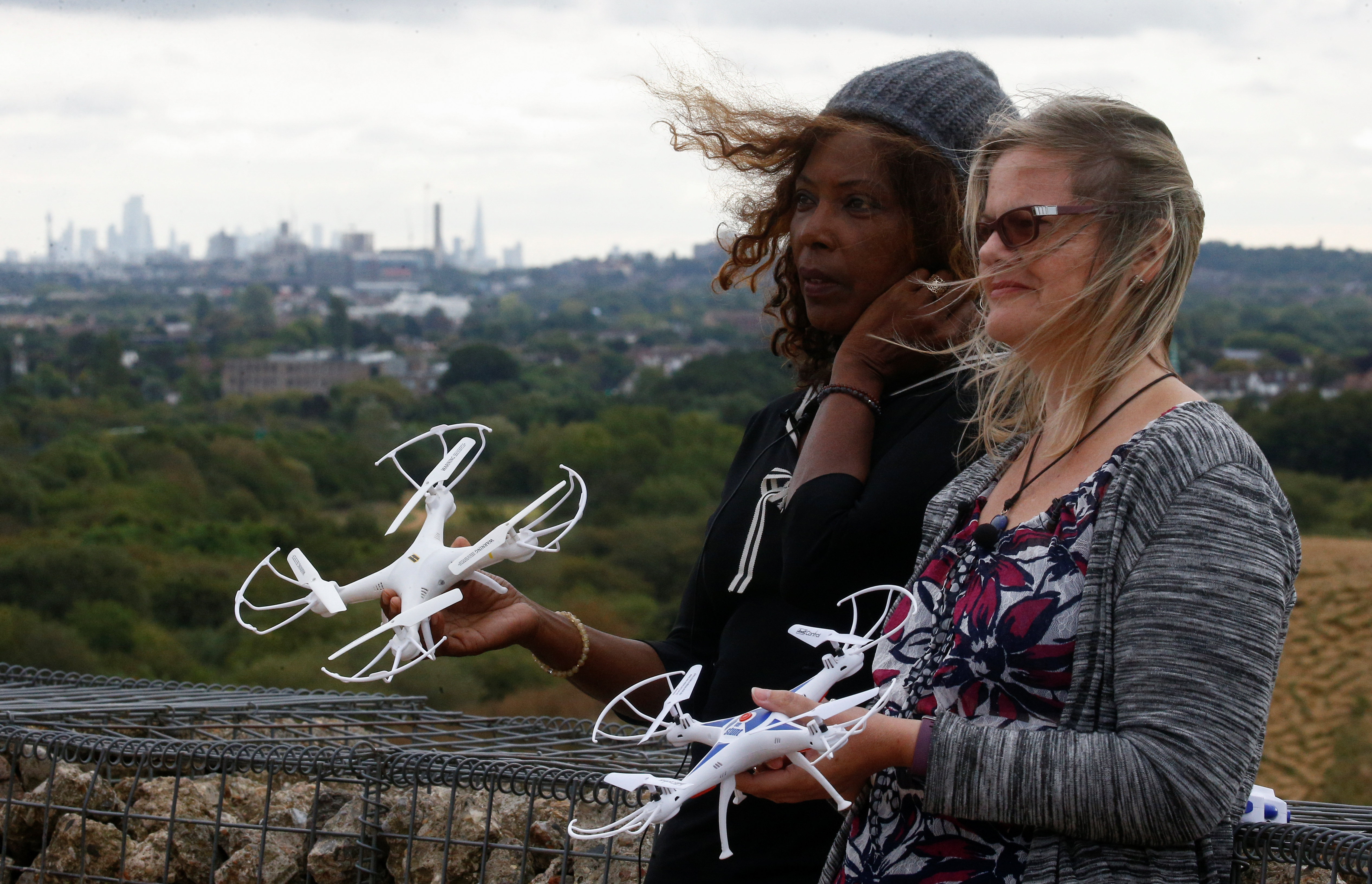 Environmental activists Valerie Milner-Brown and Linda Davidsen pose with drones near Heathrow Airport in London on Thursday. Airport authorities have slammed a planned protest action. Photo: Reuters Environmental activists Valerie Milner-Brown and Linda Davidsen pose with drones near Heathrow Airport in London on Thursday. Airport authorities have slammed a planned protest action. Photo: Reuters