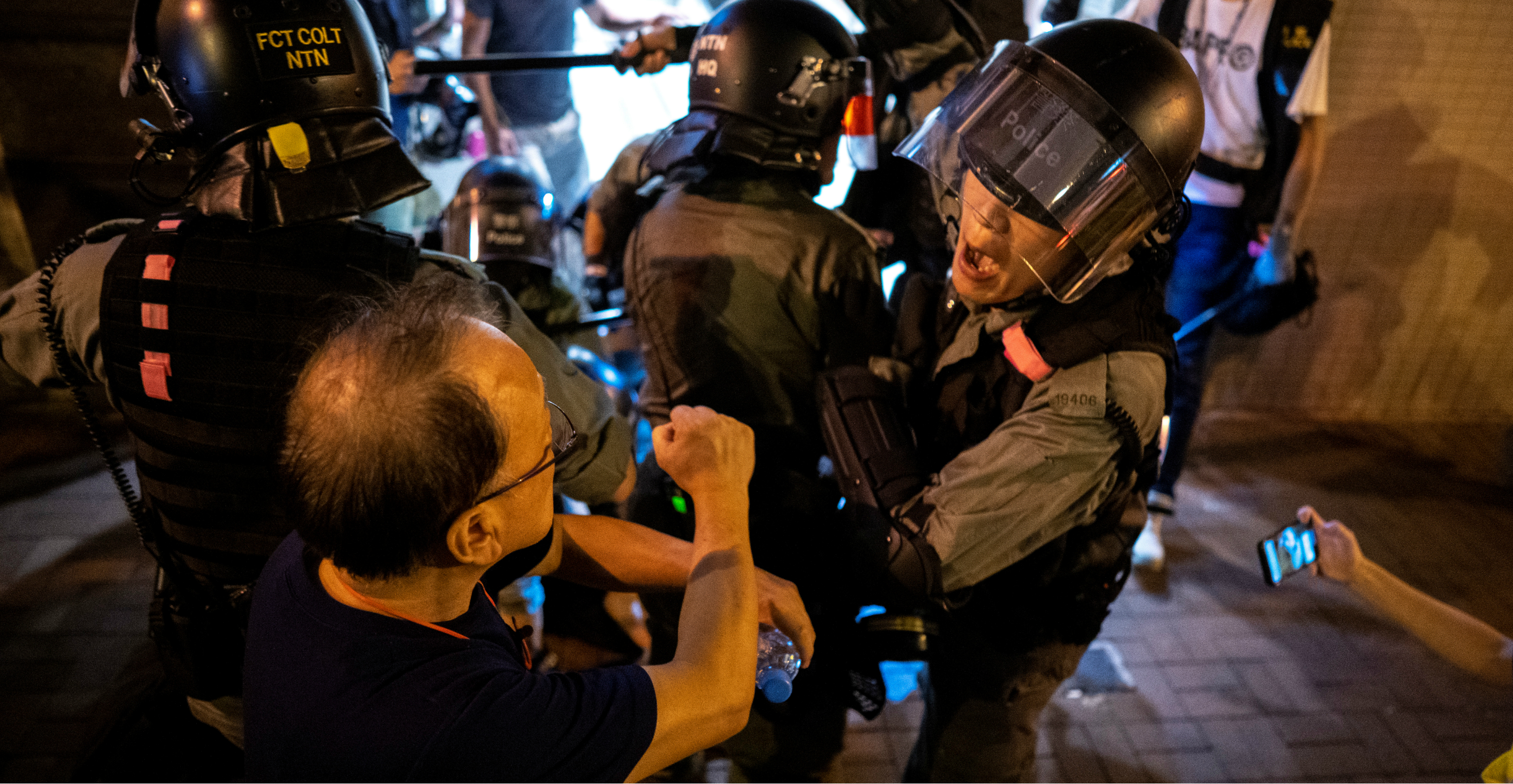 Riot police officers are confronted by local residents during a demonstration in Tseung Kwan O on Monday. Photo: Reuters Riot police officers are confronted by local residents during a demonstration in Tseung Kwan O on Monday. Photo: Reuters