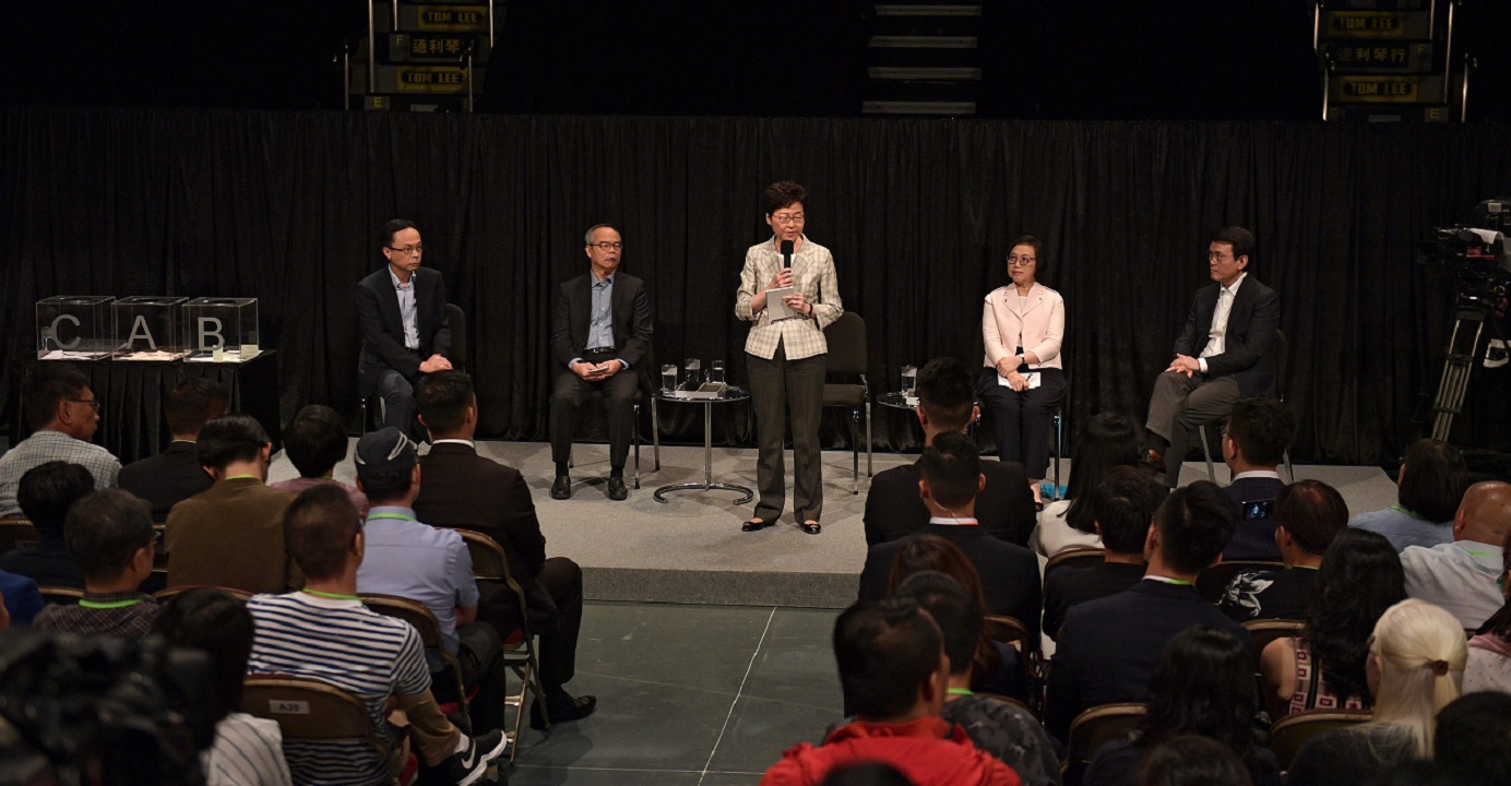 Chief Executive Carrie Lam, along with her key officials, takes part in a community dialogue at Queen Elizabeth Stadium in Wan Chai on Sept. 26. Photo: AFP Chief Executive Carrie Lam, along with her key officials, takes part in a community dialogue at Queen Elizabeth Stadium in Wan Chai on Sept. 26. Photo: AFP
