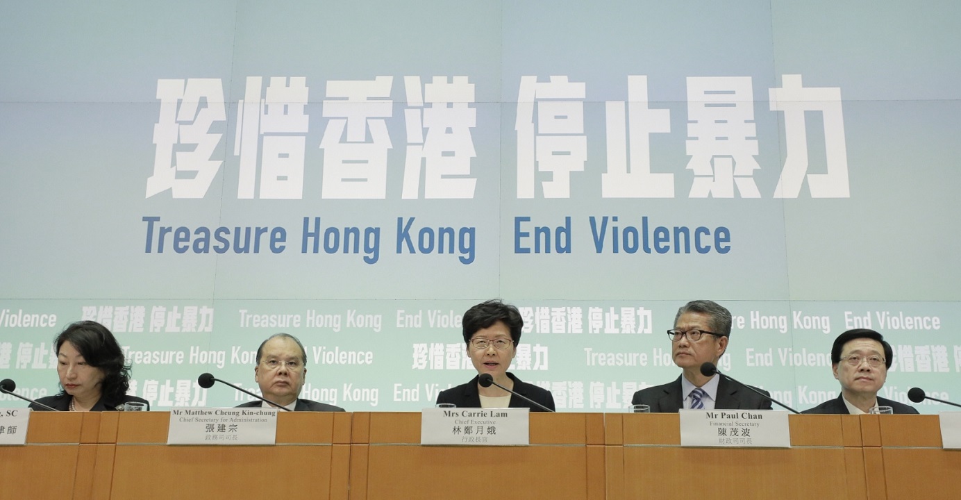 Chief Executive Carrie Lam (center), together with key officials, announces the anti-mask law on Oct. 4. Lam said on Tuesday the administration currently has no plans to invoke the emergency law again to make new laws. Photo: HKEJ Chief Executive Carrie Lam (center), together with key officials, announces the anti-mask law on Oct. 4. Lam said on Tuesday the administration currently has no plans to invoke the emergency law again to make new laws. Photo: HKEJ
