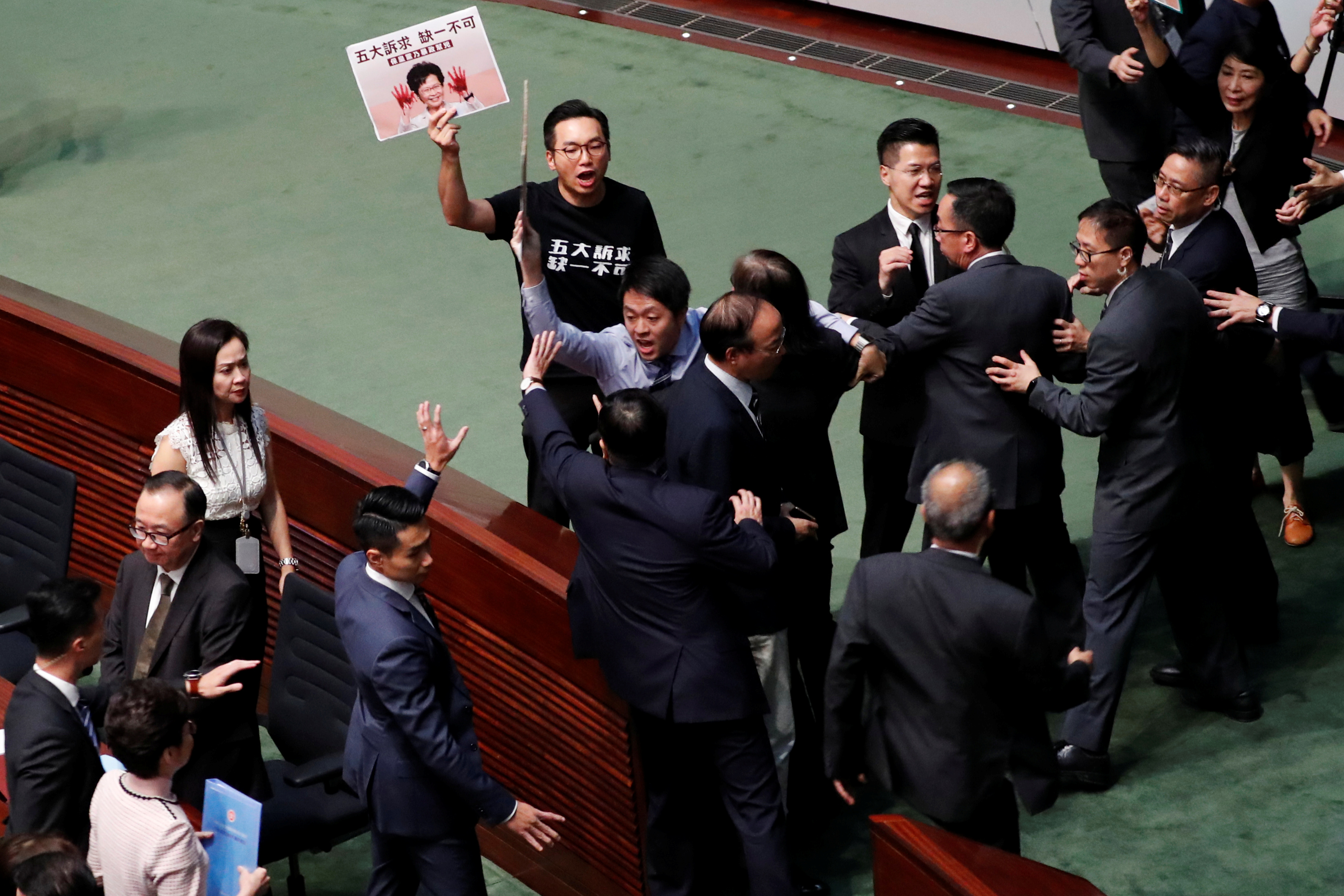 Carrie Lam leaves the Legco chamber after her annual policy address was thwarted due to protests by pro-democracy lawmakers. Photo: Reuters Carrie Lam leaves the Legco chamber after her annual policy address was thwarted due to protests by pro-democracy lawmakers. Photo: Reuters