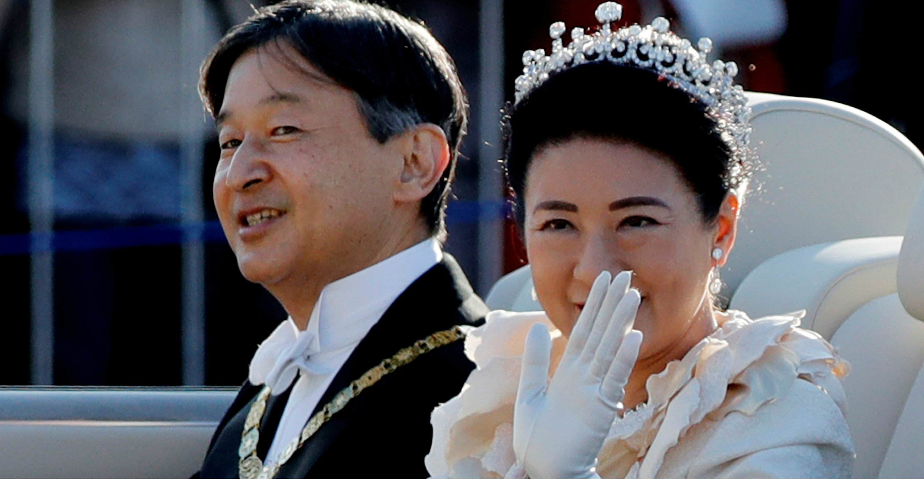 Japan's Emperor Naruhito and Empress Masako wave to well-wishers during their royal parade in Tokyo on Sunday. Photo: Reuters Japan's Emperor Naruhito and Empress Masako wave to well-wishers during their royal parade in Tokyo on Sunday. Photo: Reuters
