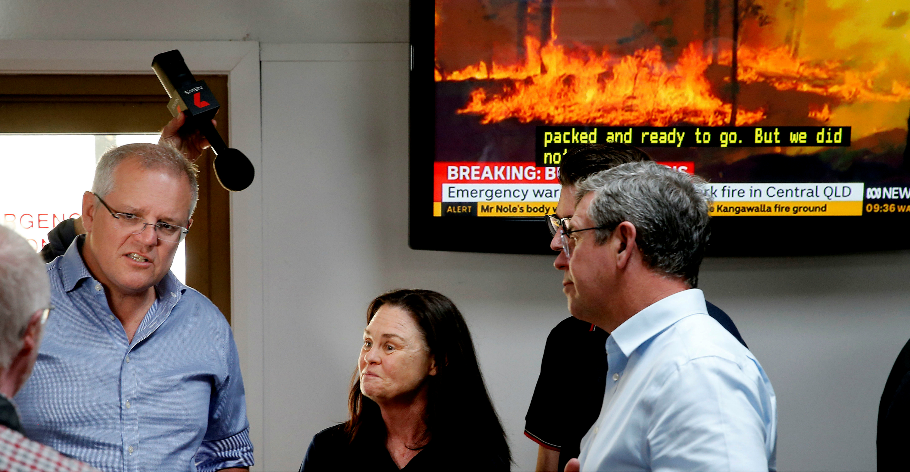 Australia's Prime Minister Scott Morrison talks to locals during a visit to the Club Taree Evacuation Center in Taree, New South Wales on Sunday. Photo: AAP via Reuters Australia's Prime Minister Scott Morrison talks to locals during a visit to the Club Taree Evacuation Center in Taree, New South Wales on Sunday. Photo: AAP via Reuters