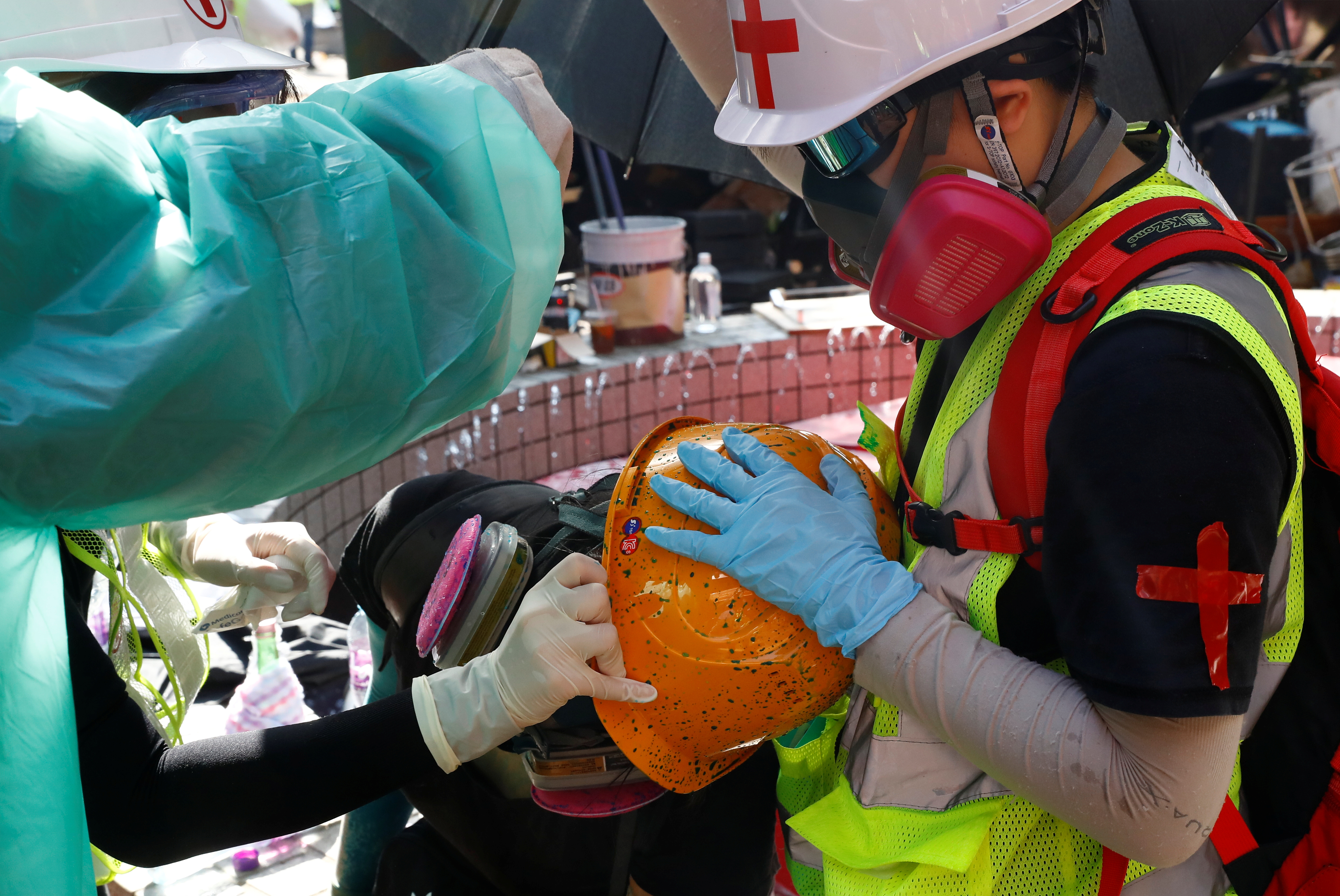 An injured demonstrator receives medical assistance during clashes with police outside Hong Kong Polytechnic University. Some NGOs have been accused of not getting involved enough in aid and relief operations amid the HK protests crisis. Photo: Reuters An injured demonstrator receives medical assistance during clashes with police outside Hong Kong Polytechnic University. Some NGOs have been accused of not getting involved enough in aid and relief operations amid the HK protests crisis. Photo: Reuters