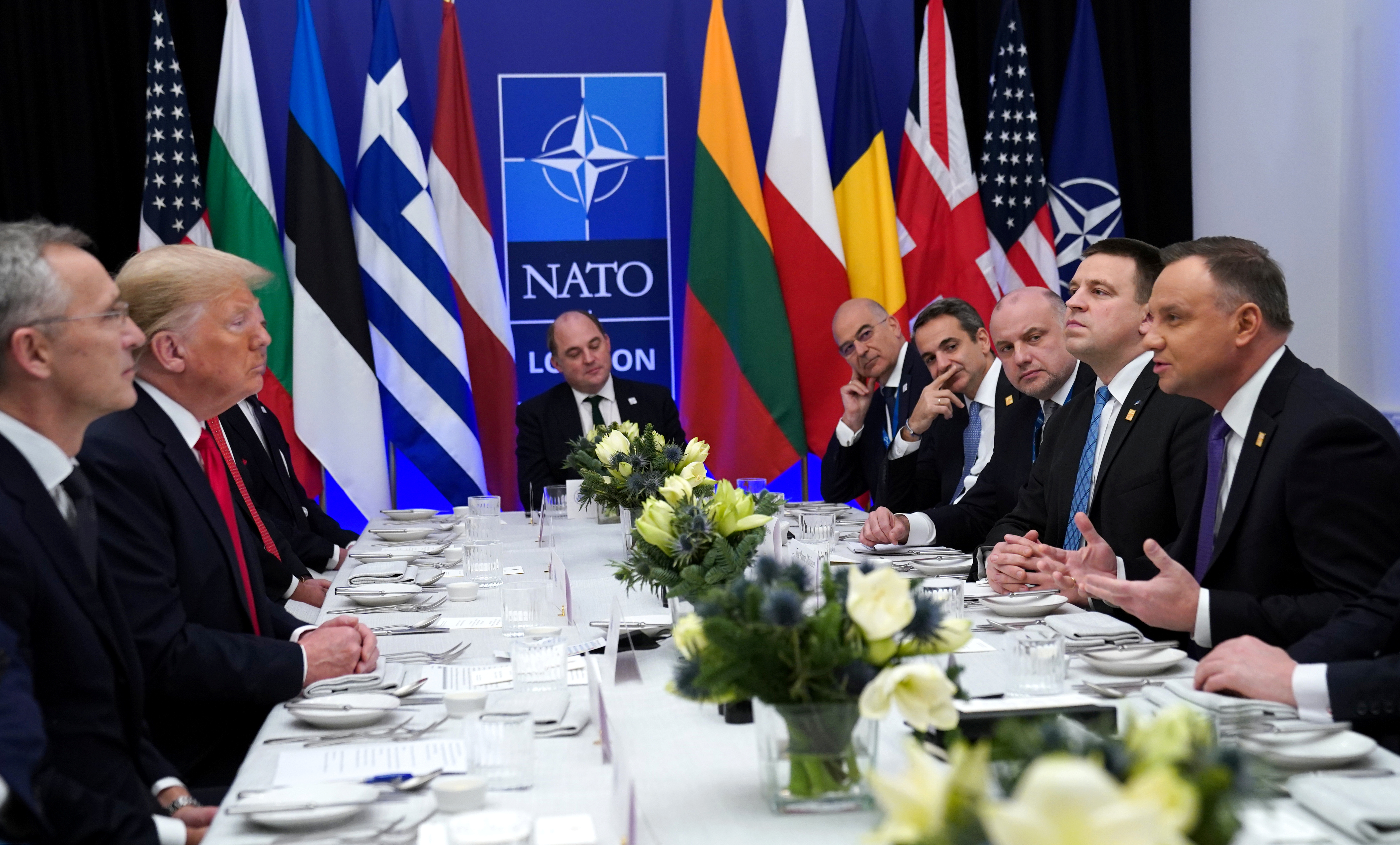 NATO Secretary General Jens Stoltenberg looks on as US President Donald Trump and Poland's President Andrzej Duda talk during a working lunch during the NATO leaders summit in Watford, Britain on Wednesday. Photo: Reuters NATO Secretary General Jens Stoltenberg looks on as US President Donald Trump and Poland's President Andrzej Duda talk during a working lunch during the NATO leaders summit in Watford, Britain on Wednesday. Photo: Reuters