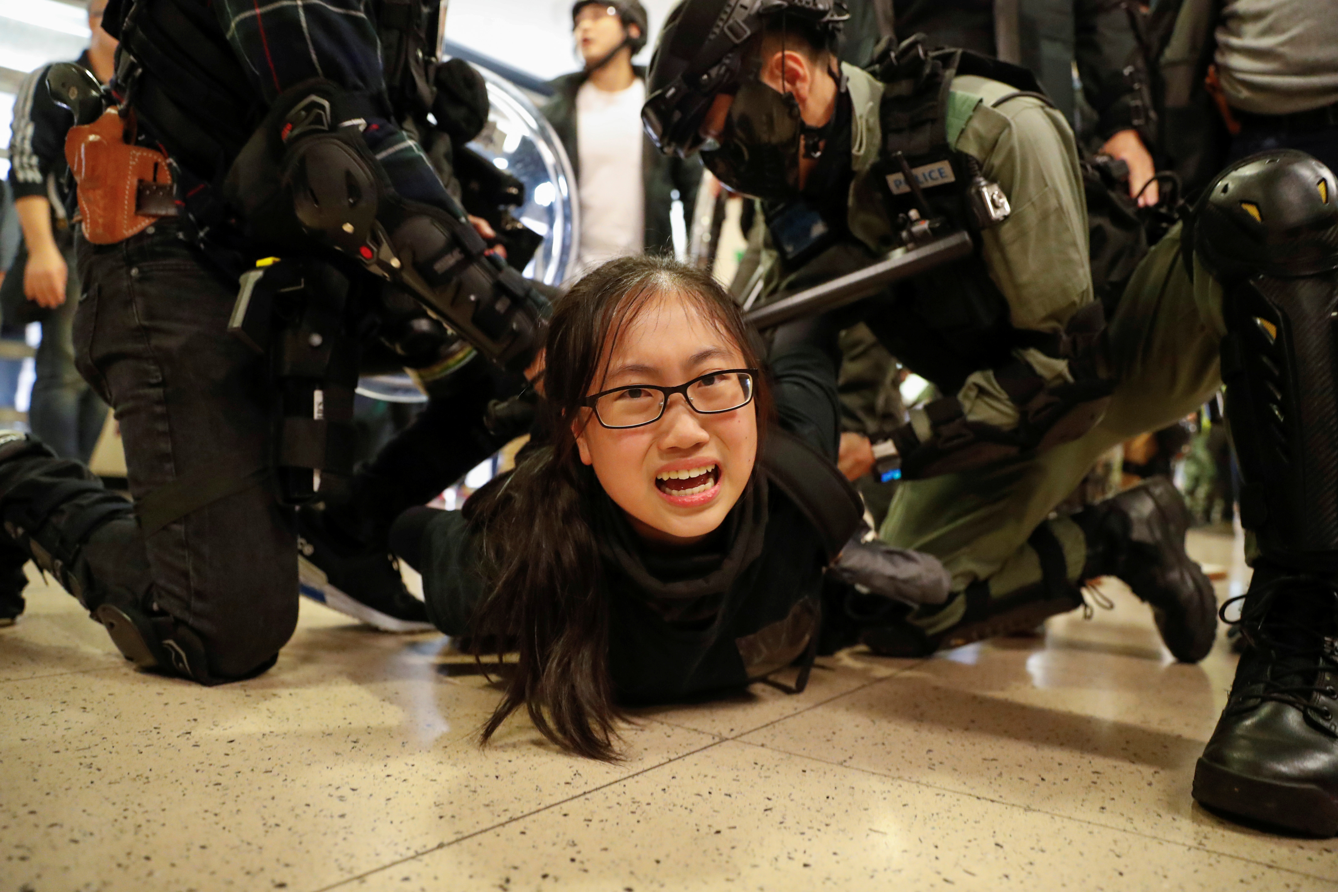 Police officers detain a protester during a demonstration inside a mall in Hong Kong on Sunday. The city’s leader, Carrie Lam, is stubbornly rejecting calls for an independent inquiry into police conduct over the past six months. Photo: Reuters Police officers detain a protester during a demonstration inside a mall in Hong Kong on Sunday. The city’s leader, Carrie Lam, is stubbornly rejecting calls for an independent inquiry into police conduct over the past six months. Photo: Reuters