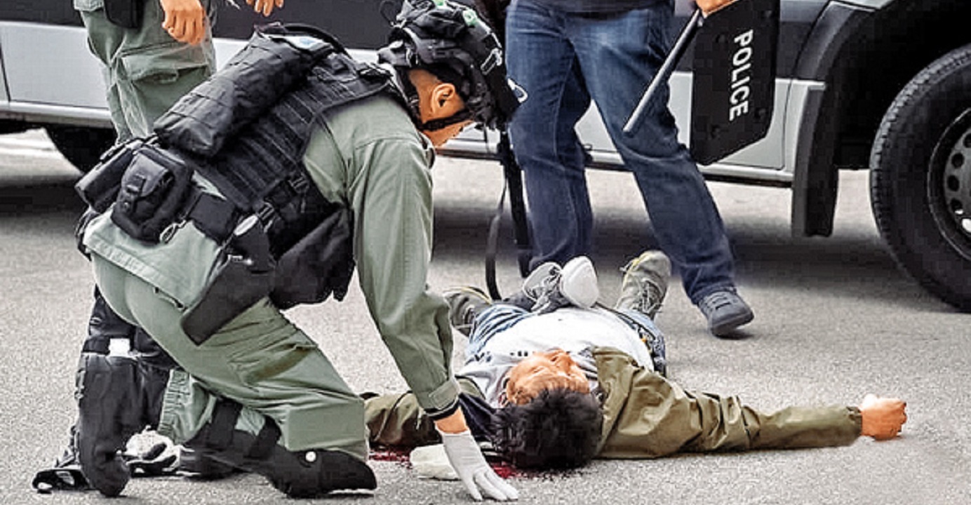 A man lies on the ground with head injury as anti-riot police enter the Lakeside Garden housing complex in Sai Kung to make arrests amid an anti-quarantine center protest on Sunday. Photo: Facebook page of Editorial Board of CityU Students' Union A man lies on the ground with head injury as anti-riot police enter the Lakeside Garden housing complex in Sai Kung to make arrests amid an anti-quarantine center protest on Sunday. Photo: Facebook page of Editorial Board of CityU Students' Union