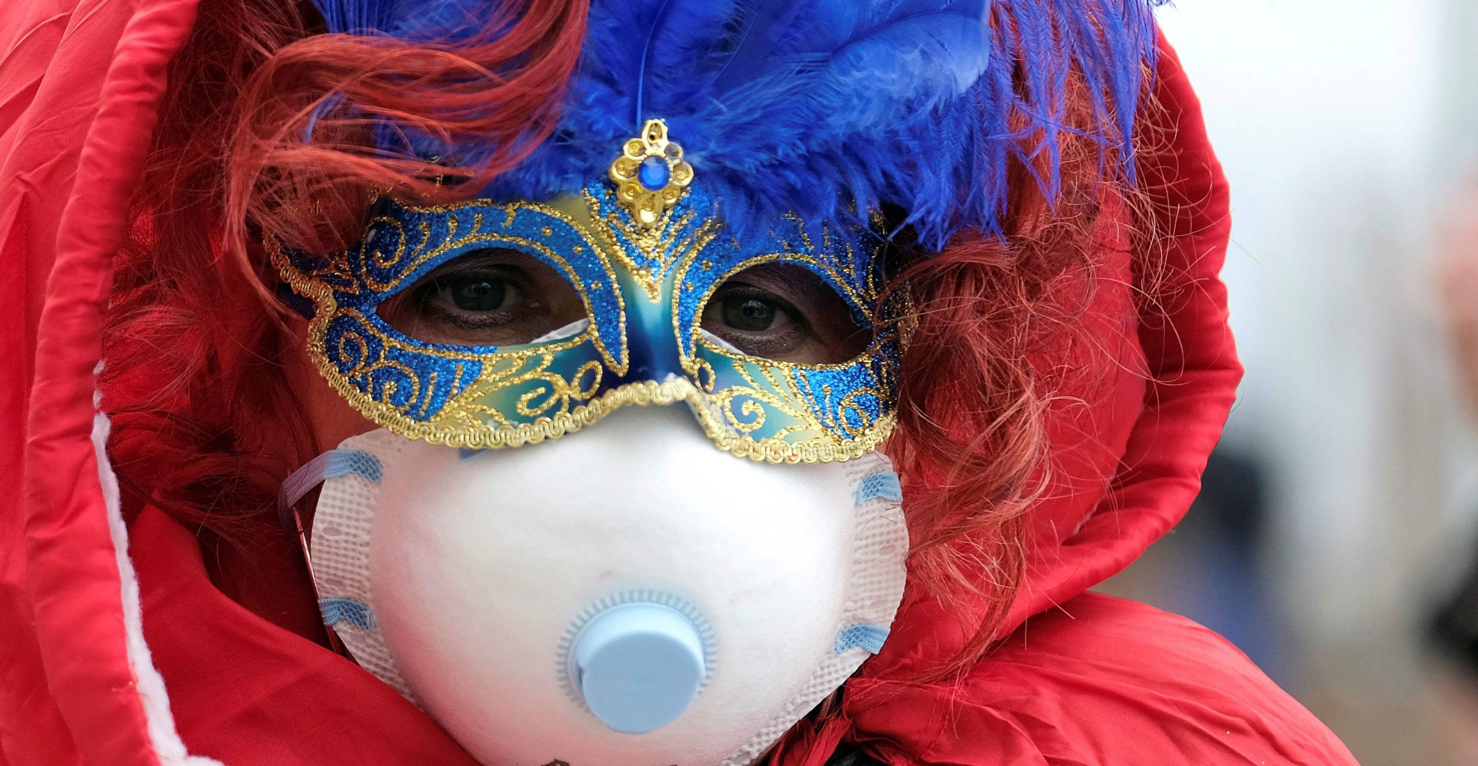 A reveller wears a protective face mask at the Venice Carnival in Venice, Italy on Sunday. The last two days of the carnival as well as Sunday night's festivities have been cancelled because of an outbreak of coronavirus. Photo: Reuters A reveller wears a protective face mask at the Venice Carnival in Venice, Italy on Sunday. The last two days of the carnival as well as Sunday night's festivities have been cancelled because of an outbreak of coronavirus. Photo: Reuters