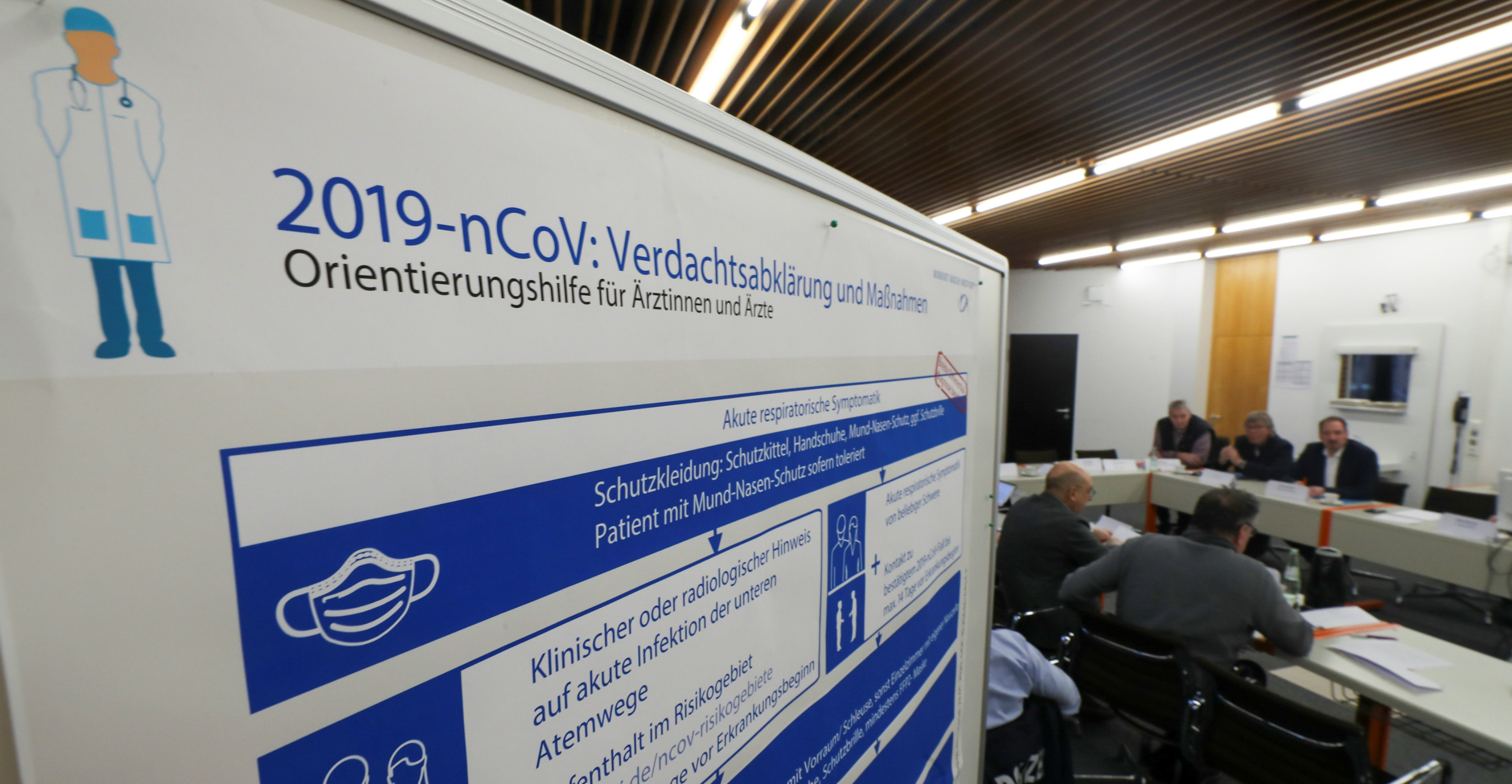 Members of a coronavirus crisis management group gather in the western German district of Heinsberg near Aachen on Thursday after several positive cases of Covid-19 were found in the district. Photo: Reuters Members of a coronavirus crisis management group gather in the western German district of Heinsberg near Aachen on Thursday after several positive cases of Covid-19 were found in the district. Photo: Reuters