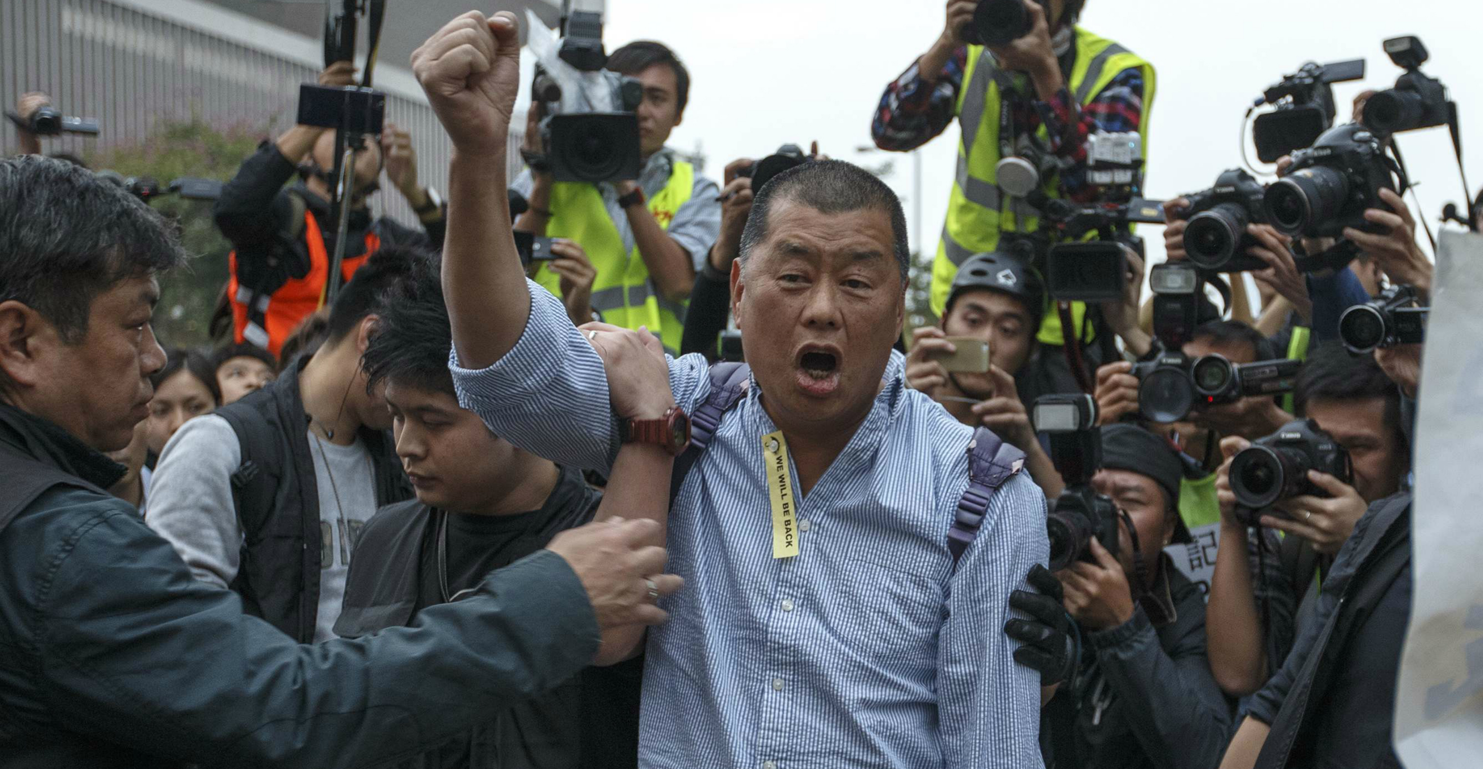 Jimmy Lai, shown here before he was taken away by police in December 2014, is accused of participating in an illegal assembly on Aug. 31. Photo: Reuters Jimmy Lai, shown here before he was taken away by police in December 2014, is accused of participating in an illegal assembly on Aug. 31. Photo: Reuters