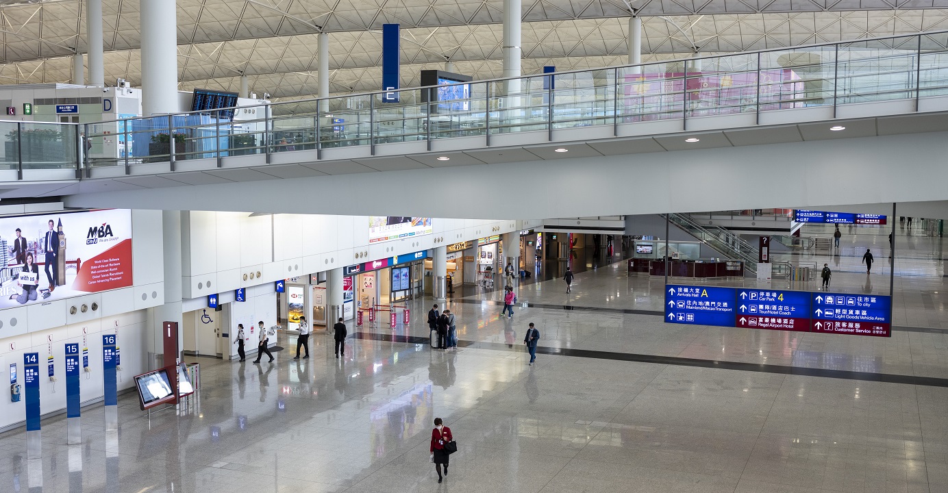 People walk through the near-empty arrivals hall of the Hong Kong International Airport. The number of imported Covid-19 cases is likely to increase as more Hongkongers return from study or business trips abroad, health authorities said. Photo: Bloomberg People walk through the near-empty arrivals hall of the Hong Kong International Airport. The number of imported Covid-19 cases is likely to increase as more Hongkongers return from study or business trips abroad, health authorities said. Photo: Bloomberg