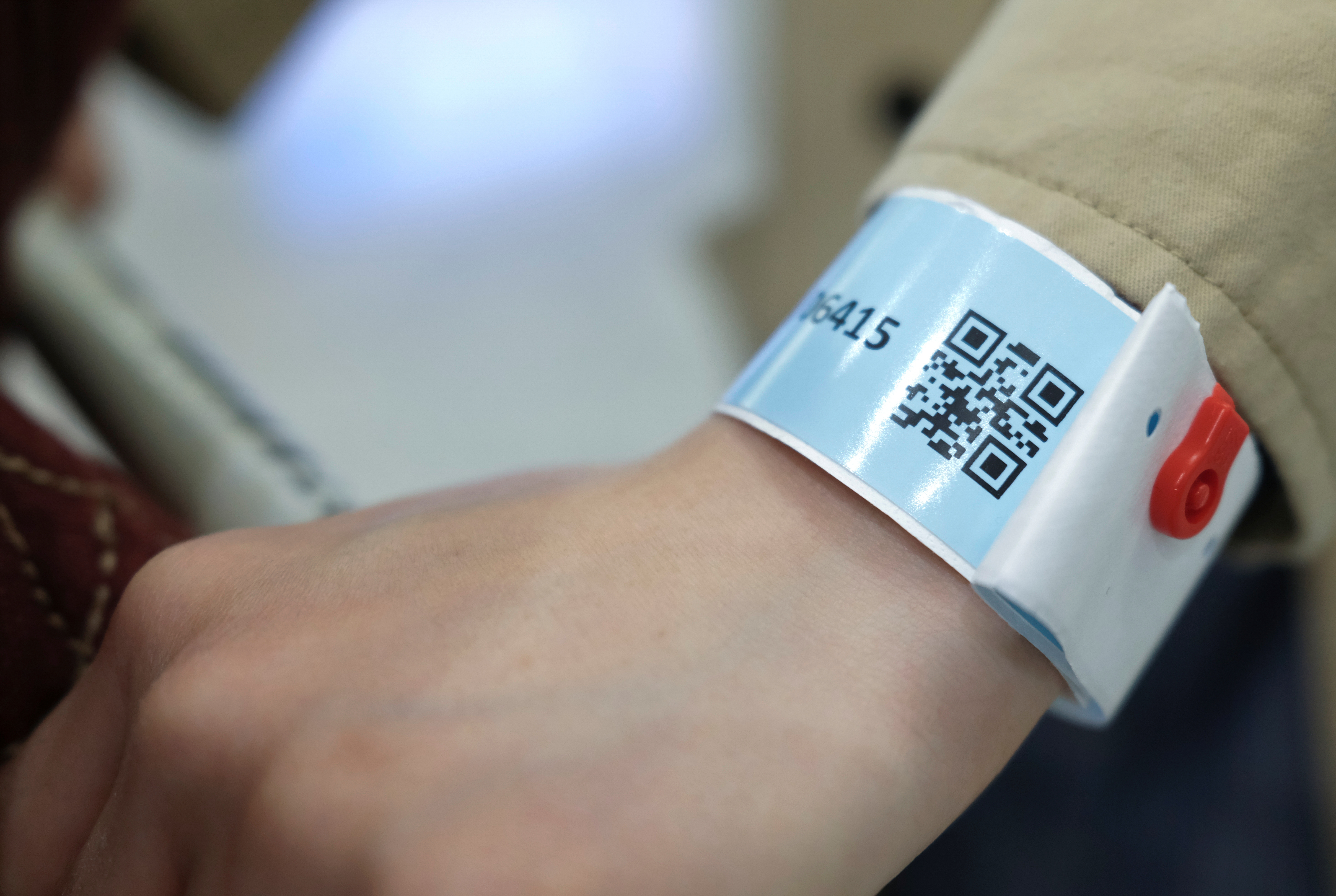 A passenger wears an electronic wrist band handed upon arrival at the Hong Kong airport as authorities enforce quarantine rules amid the coronavirus outbreak. Photo: Reuters A passenger wears an electronic wrist band handed upon arrival at the Hong Kong airport as authorities enforce quarantine rules amid the coronavirus outbreak. Photo: Reuters