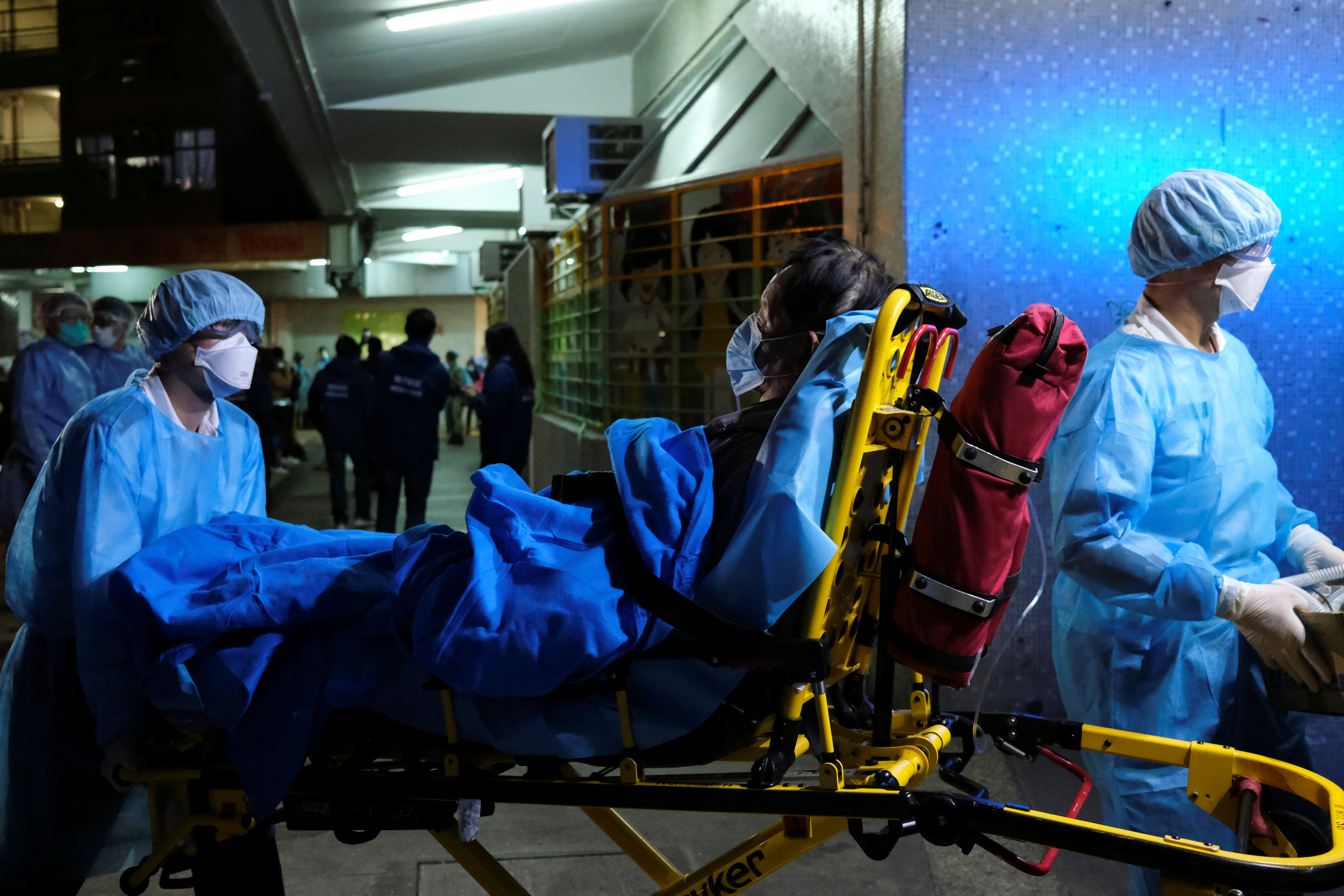 A file picture shows paramedics carrying a patient in a stretcher on to an ambulance in Hong Kong on March 14. The city has witnessed a worrisome rise in confirmed Covid-19 cases in the past few days. Photo: Reuters A file picture shows paramedics carrying a patient in a stretcher on to an ambulance in Hong Kong on March 14. The city has witnessed a worrisome rise in confirmed Covid-19 cases in the past few days. Photo: Reuters