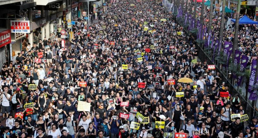 People join the July 1 protest march every year since 1997 for political and livelihood issues.  Photo: Reuters