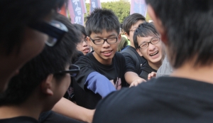 Who will give Joshua Wong a ticket to university?