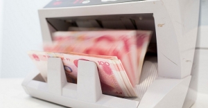 Yuan band widening unlikely until at least 2H: StanChart