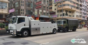 PLA truck towed by Japanese-branded wrecker