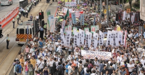 How will China redefine democracy in Hong Kong and why?