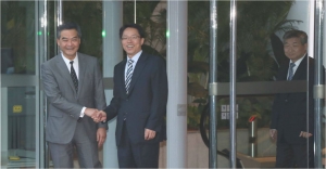 Is the Liaison Office pressing for an official position in HK?