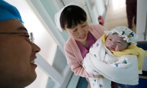 China academics suggest 'no-child tax' to boost fertility rate