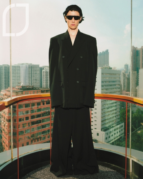 Deconstructed Jacket In Black Dry Wool Twill, Double Front Pants In Black Dry Wool Twill and Anatomic Bootie In Black Knit. All from Balenciaga.